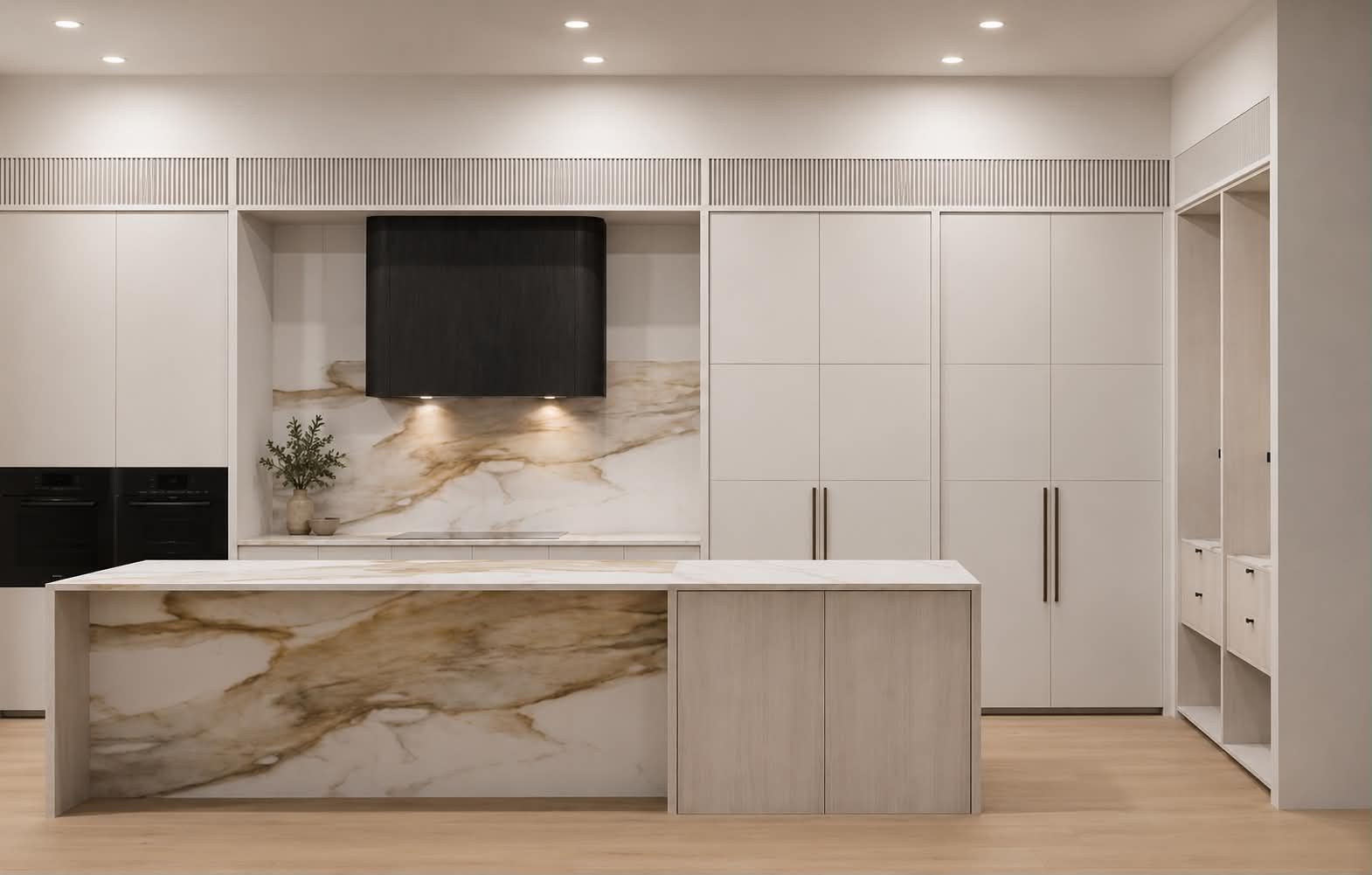 Custom kitchen with marble island and detailed cabinetry by Masterpiece Cabinetry